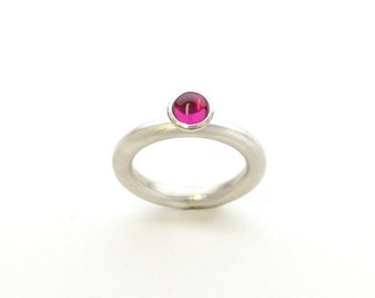 Silver ring with round ruby