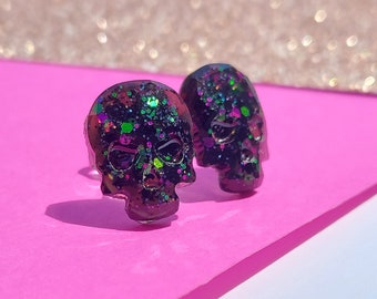 DARE – GLITTER, resin skull studs for men and women in glitter jewel tones