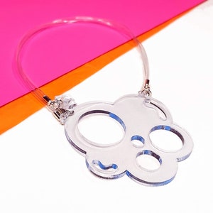 THE SWISS. Clear transparent geometric circles bib necklace