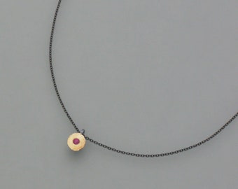 Blackened necklace with ruby, patina