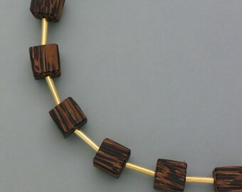 New necklace with cubes made of zebrawood