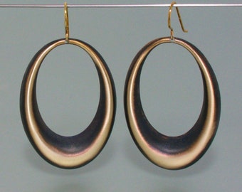 Plastic earrings, blackened