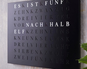 WordClock Jupiter laser-cut steel in matte black - elegant designer word clock in German - modern LED wall clock for home and office