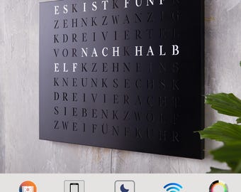 Word clock made of laser-cut stainless steel in black, silver & gold - large LED wall clock in a modern and minimalist style for home and office