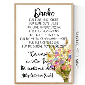 Könnte beinhalten: Gerahmter Druck mit hellem Holzmaserungsrand. Der Druck zeigt eine handschriftliche Nachricht auf Deutsch, einen bunten Blumenstrauß und die Worte "Danke" und "Wir waren ein tolles Team!"