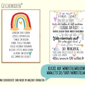 May include: Two framed art prints with inspirational quotes. One features a rainbow and the text "Enjoy life, play in the mud, dance in the rain." The other has a unicorn and the text "Have fun, believe in yourself, never give up."