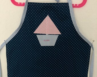 Children's apron blue with pink sailing boat