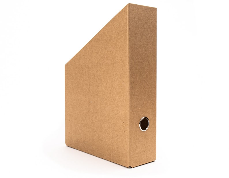 May include: A brown cardboard hanging file folder with a metal ring on the side.