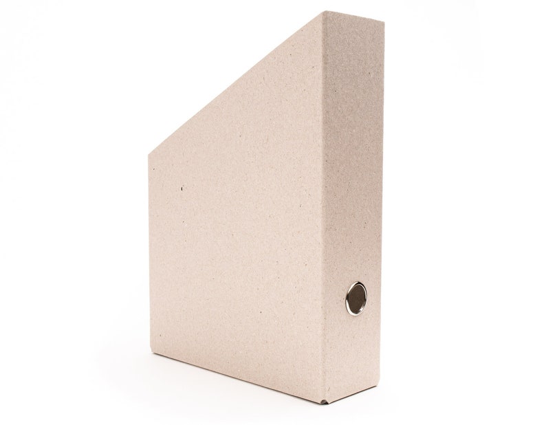 May include: A brown cardboard file folder with a metal ring binder mechanism.