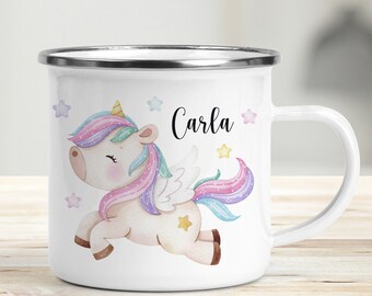 May include: White enamel mug featuring a colourful cartoon unicorn with a rainbow mane and tail, and the name "Carla" printed on the mug.