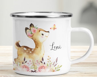 May include: White enamel mug with a silver rim featuring a watercolour illustration of a fawn with a floral crown, a butterfly, and pink flowers. The mug has the name "Leni" written in black cursive.