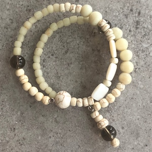 A cream bead bracelet.
