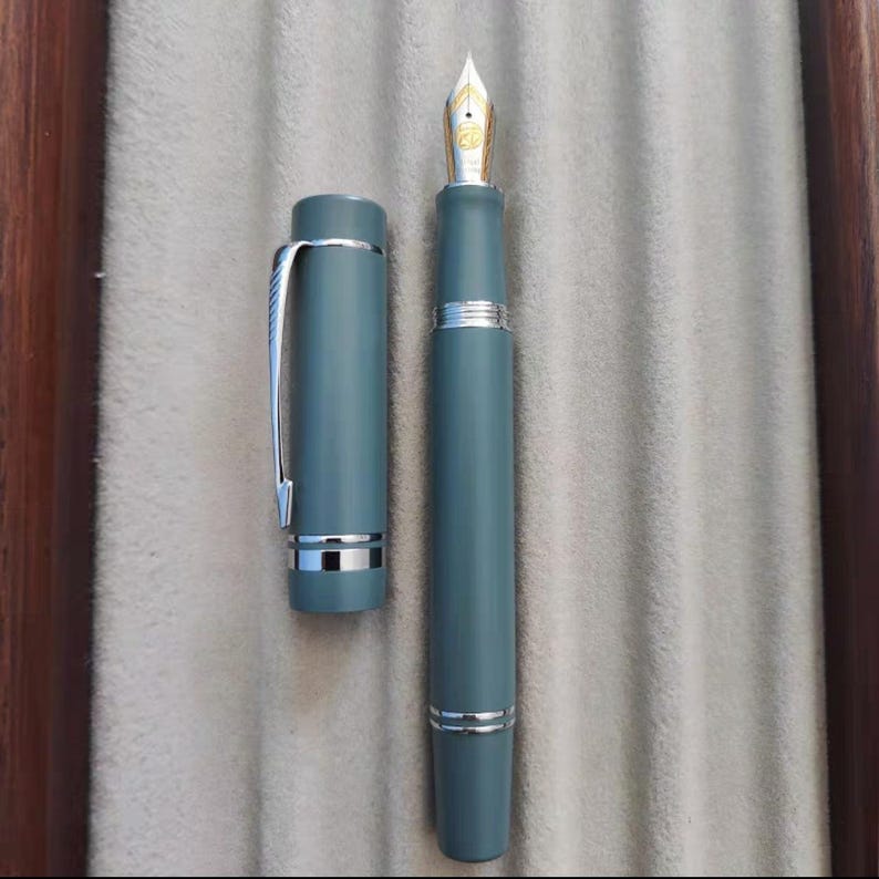 Pluma estilográfica St. Penpps con tapa de émbolo y crisantemo limón - Plumín Togi EF/F/Naginata Blue