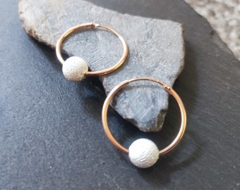 A pair of hoop earrings made of 925 silver (rose gold plated) with movable 8 mm silver ball. Creole approx. 25 mm