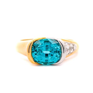 GIA Certified Vintage 5.25 Carat Oval Cut Blue Zircon & Diamond Bypass 18K Gold Ring, Half Bezel Blue Zircon 2 Tone Richard Krementz  Ring
