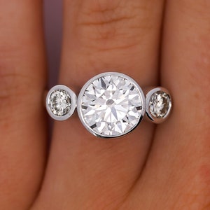 4.42 Carat IGI Certified G Color SI1 Clarity Round Brilliant Lab Grown Diamond Engagement Ring In 18K White Gold with 2 Diamond Side Stones