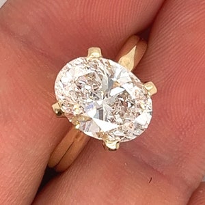 IGI-certifierad 3,52 karat ovalslipad diamant i 4-stifts solitaire-infattning i 14k guld | 3,5 karat, ovalslipad, G/VS1 | Ovulad
