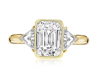 BOUCHERON Signed Ring With Bezel Set GIA Certified 2.09 Carat Emerald Cut E/SI1 Diamond and Trillion Side Stones