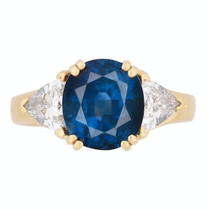 GIA Certified 4.40 Oval Blue Sapphire and Trillion Cut 3-Stone Ring in 18 Karat Yellow Gold | 3-Stone Sapphire & Diamond Engagement Ring