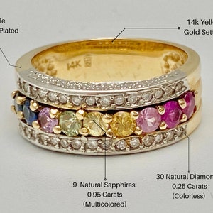May include: A 14k yellow gold ring with a double rhodium plated band. The ring features a row of 9 multicolored sapphires and a row of 30 colorless diamonds. The ring is 0.95 carats total weight for the sapphires and 0.25 carats total weight for the diamonds.