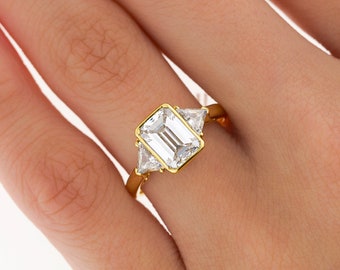 BOUCHERON Signed Ring With Bezel Set GIA Certified 2.09 Carat Emerald Cut E/SI1 Diamond and Trillion Side Stones