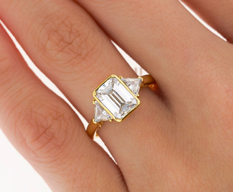 BOUCHERON Signed Ring With Bezel Set GIA Certified 2.09 Carat Emerald Cut E/SI1 Diamond and Trillion Side Stones image 1