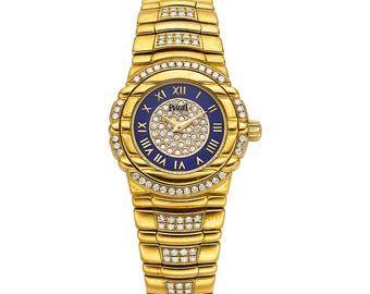 Reloj vintage Piaget Tanagra de cuarzo con diamantes y lapislázuli en oro de 18 quilates con brazalete de diamantes integrados de 25 mm. Caja y documentación.