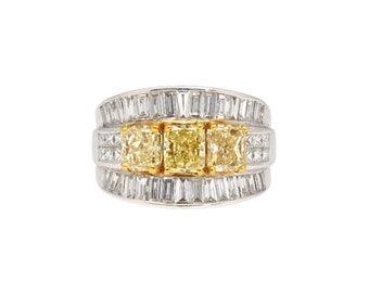 3.28 Carat TW Natural Radiant Cut Fancy Yellow Diamond 3-Stone Ring in 18K White Gold With Baguette and Princess Cut Row Diamond Cluster