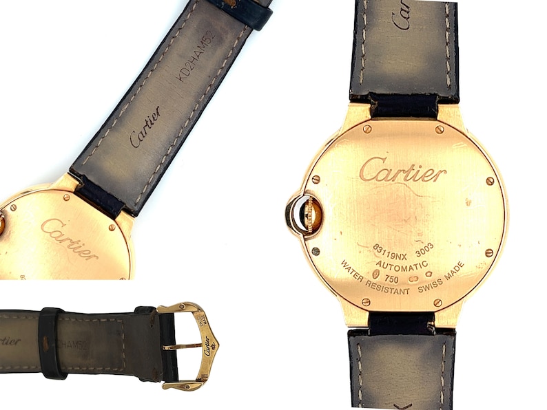 May include: A gold Cartier watch with a black leather band. The back of the watch has the words 'Cartier', '83119NX', '3003', 'AUTOMATIC', '750', 'WATER RESISTANT', 'SWISS MADE' engraved on it.