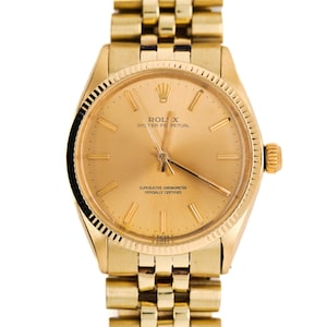 1970s Rolex Oyster Perpetual Ref 1005 with Fluted Bezel and Jubilee Bracelet in 14k Yellow Gold 36mm