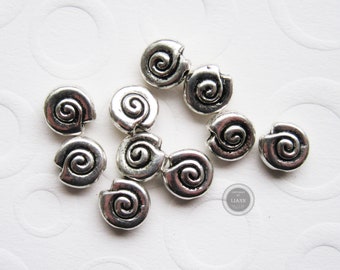 10 silberne Metallperlen Schnecke 7 mm