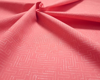 Cotton fabric from the Emilie series by Hilco. Salmon color with labyrinth pattern white..