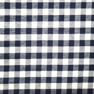 May include: A white and navy blue checkered fabric with a woven texture.