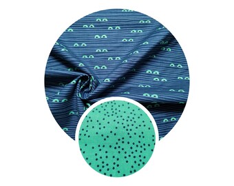 Cotton fabric Peak and combination fabric Glade Glimmer from the Everglades series by Michael Miller. Crocodile eyes and matching polka dot fabric.