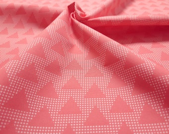 Cotton fabric from the Emilie series by Hilco. Salmon colored with triangles.