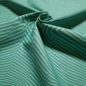 Könnte beinhalten: Tealfarbener Stoff mit einem geometrischen Muster aus überlappenden Streifen und Quadraten.