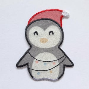 Winterlicher Aufnäher/Bügelapplikationen von Glünz Pinguin