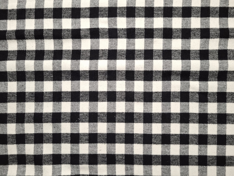 May include: Black and white checkered fabric with a woven texture.