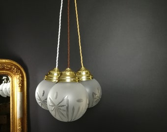 Viennese hanging lamp with old hand-cut, mouth-blown glass ball lamp with fabric cable. Pendant lamp with brass ceiling rosette