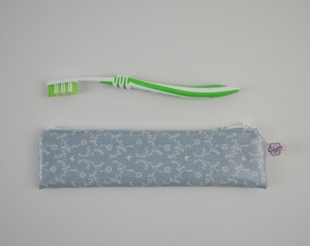 Toothbrush bag floral tendrils on blue