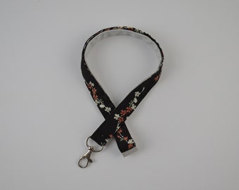 Lanyard long fleurs de cerisier sur fond noir avec beige