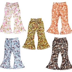 May include: Five pairs of bell bottom pants with different floral patterns. The pants are in pink, orange, yellow, blue, and black.