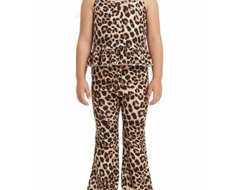 May include: A two-piece leopard print outfit for children. The set includes a camisole top with a ruffled hem and spaghetti straps, and flared pants. The fabric features a tan background with brown spots.