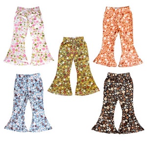 May include: Five pairs of bell bottom pants with floral patterns. The pants are in pink, orange, green, blue, and brown.