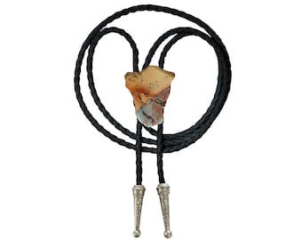 May include: A black bolo tie with a silver-toned tip and a large, irregularly shaped, multi-colored stone pendant.