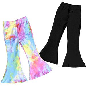 May include: Two pairs of flared pants. One pair is black and the other is a tie-dye pattern with blue, yellow, pink, and orange colors.