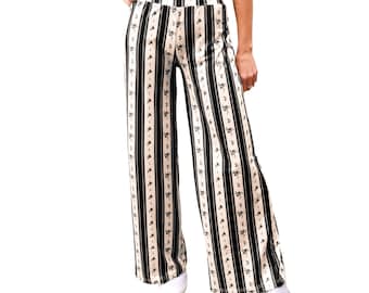 Pantalón palazzo negro con estampado floral a rayas, estilo casual, de talle medio a alto, cintura elástica, corte holgado, pierna ancha y tejido de punto elástico.
