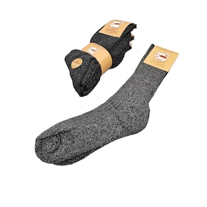 May include: A pair of gray socks with a textured knit pattern. The socks are folded and packaged with a brown label that says "Zalando Socks".