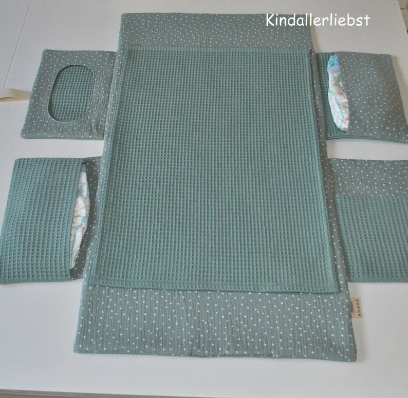 Diaper bag with changing mat that can be wiped clean for on the go image 1