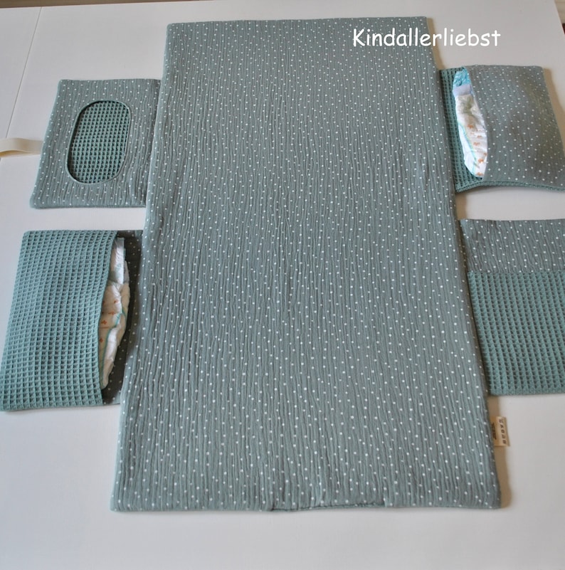 Diaper bag with changing mat that can be wiped clean for on the go image 2